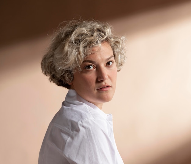 Portrait of woman posing in white shirt