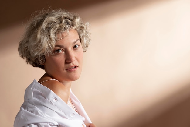 Portrait of woman posing in white shirt