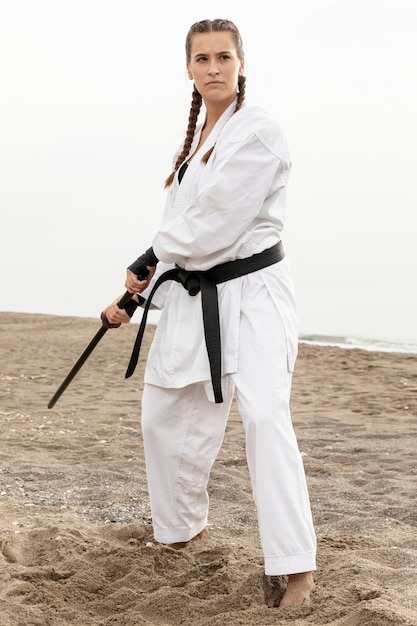 Free photo portrait of woman practicing martial art