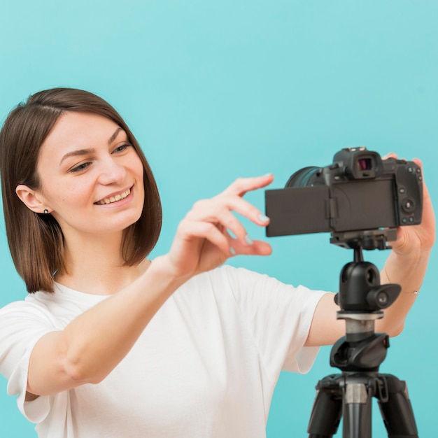 Portrait of woman recording at home