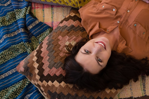 Portrait of woman relaxing in tent