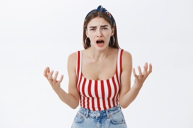 Free photo portrait of woman shaking hands crying and yelling, frowning and whining complaining