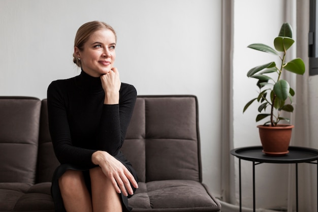 Portrait woman sitting on couch