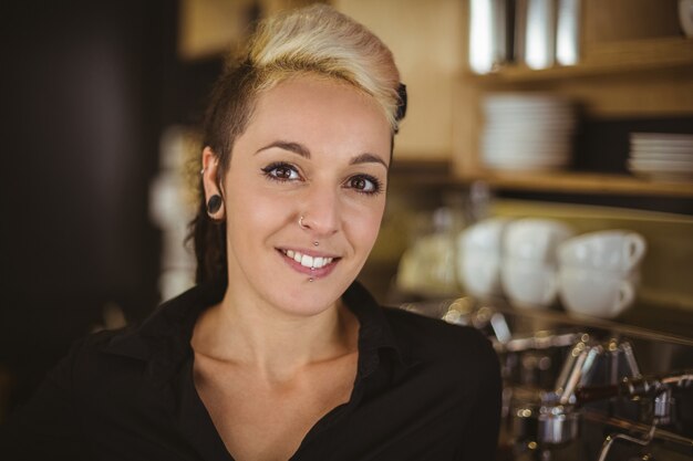 Portrait of woman standing in kitchen