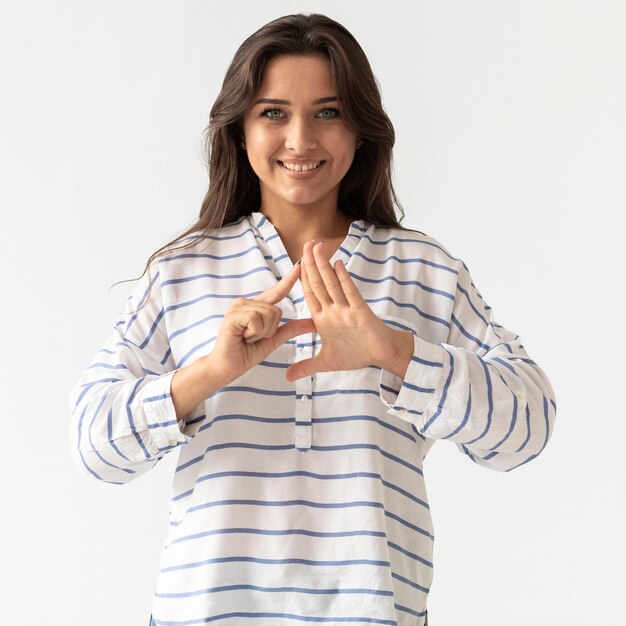 Portrait of woman teaching sign language