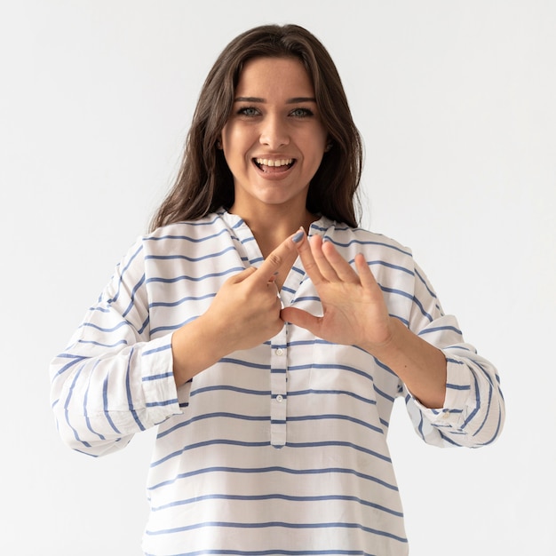 Portrait of woman teaching sign language