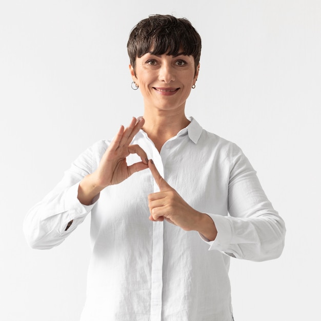 Portrait of woman teaching sign language