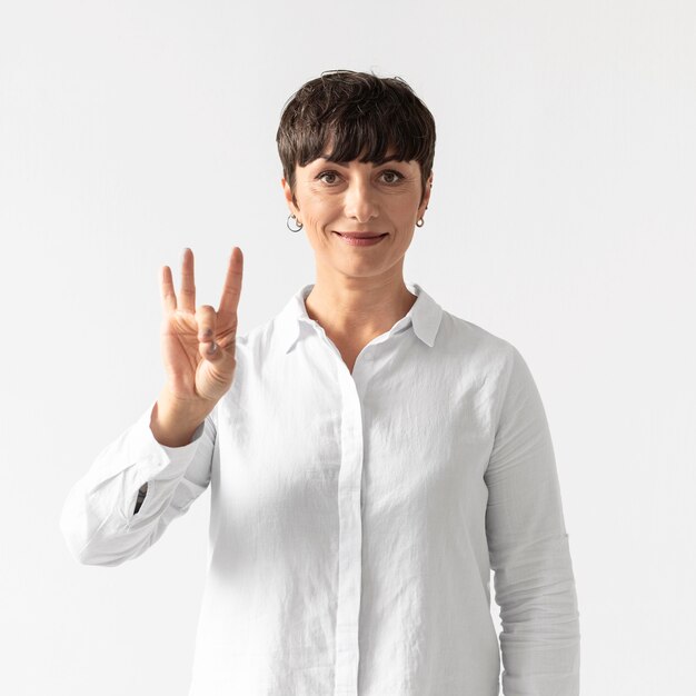 Portrait of woman teaching sign language