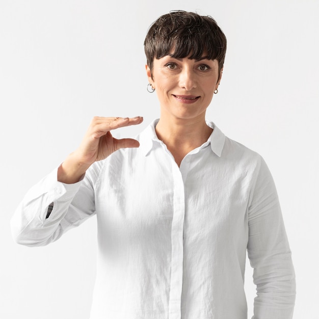 Portrait of woman teaching sign language