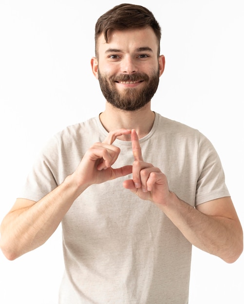 Free photo portrait of woman teaching sign language