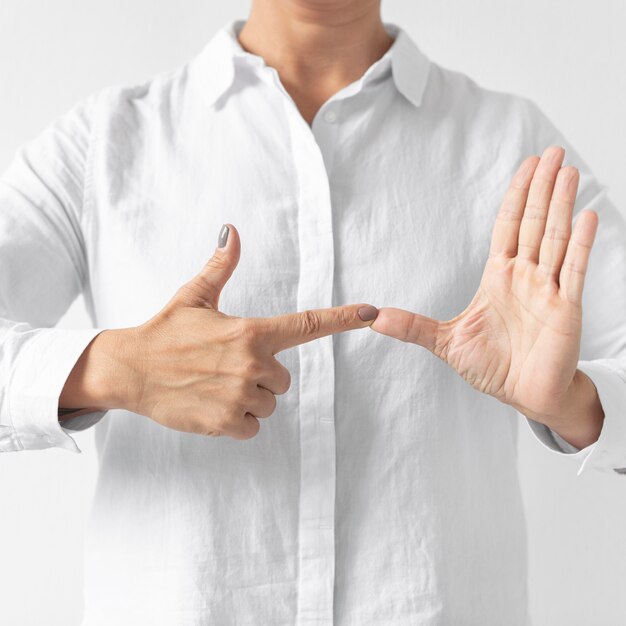 Portrait of woman teaching sign language