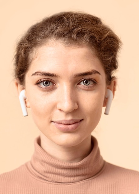 Portrait of woman using air pods