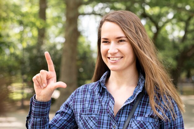 Portrait of woman using sign language