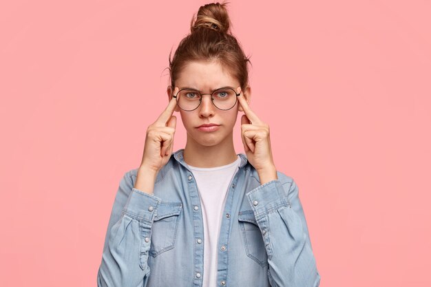 Portrait of woman wearing denim shirt