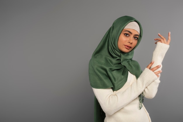 Portrait of woman wearing hijab isolated