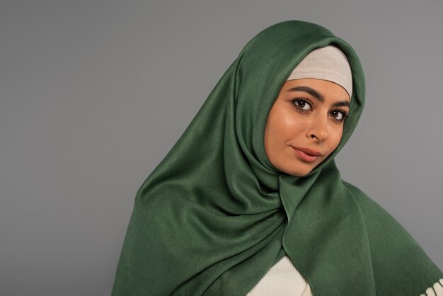 Portrait of woman wearing hijab isolated