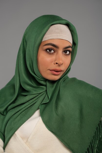 Portrait of woman wearing hijab isolated