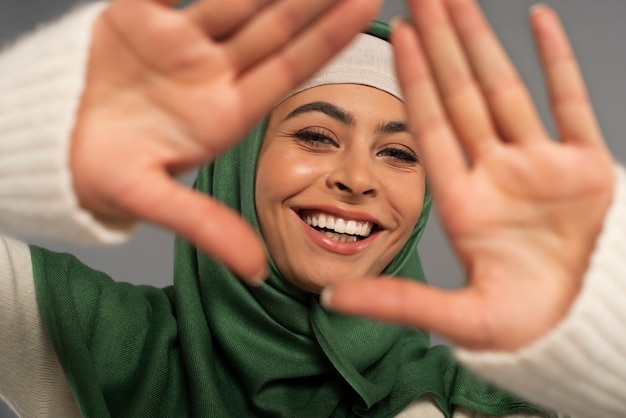 Portrait of woman wearing hijab isolated