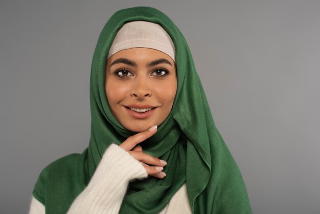 Portrait of woman wearing hijab isolated