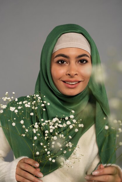 Portrait of woman wearing hijab isolated