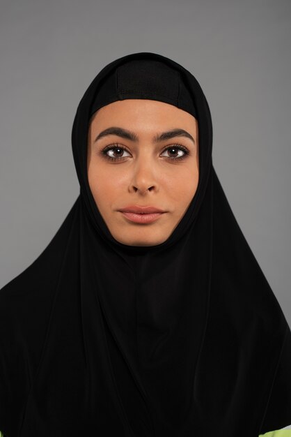 Portrait of woman wearing hijab isolated