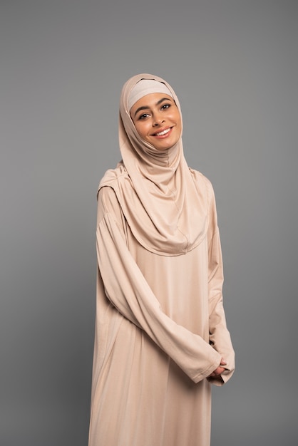 Portrait of woman wearing hijab isolated