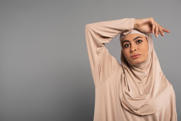 Portrait of woman wearing hijab isolated