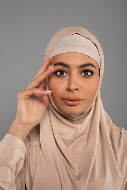 Portrait of woman wearing hijab isolated