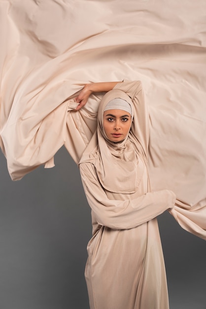 Portrait of woman wearing hijab isolated