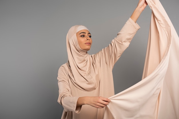 Portrait of woman wearing hijab isolated