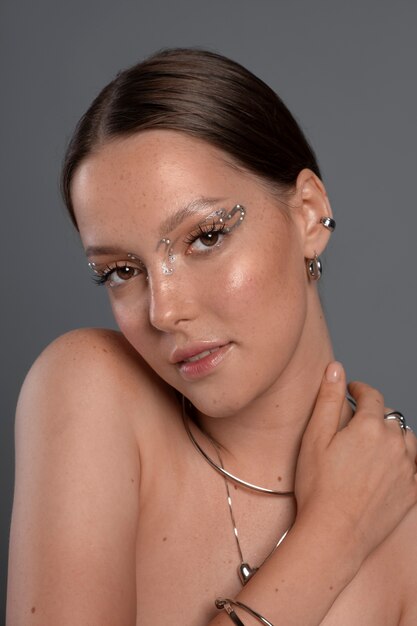 Portrait of woman wearing jewelry makeup