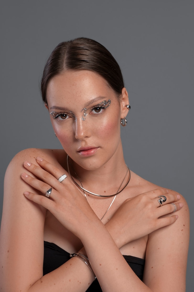Free Photo portrait of woman wearing jewelry makeup