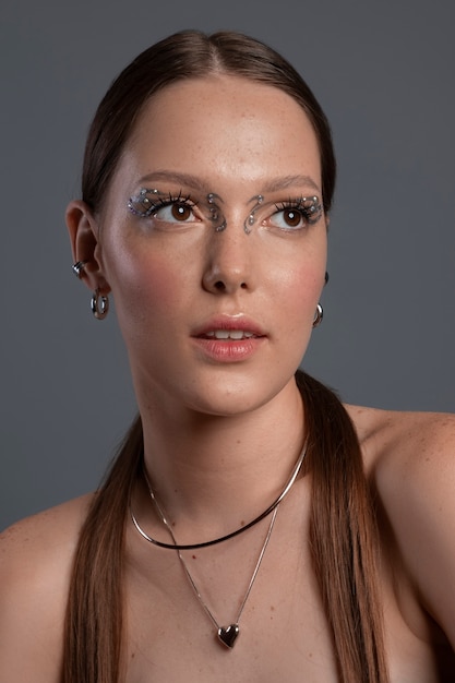 Portrait of woman wearing jewelry makeup