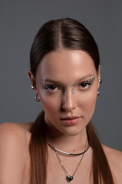 Free photo portrait of woman wearing jewelry makeup