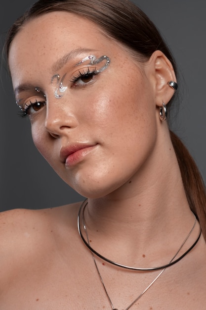 Portrait of woman wearing jewelry makeup