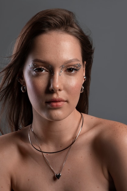 Portrait of woman wearing jewelry makeup