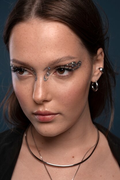 Portrait of woman wearing jewelry makeup