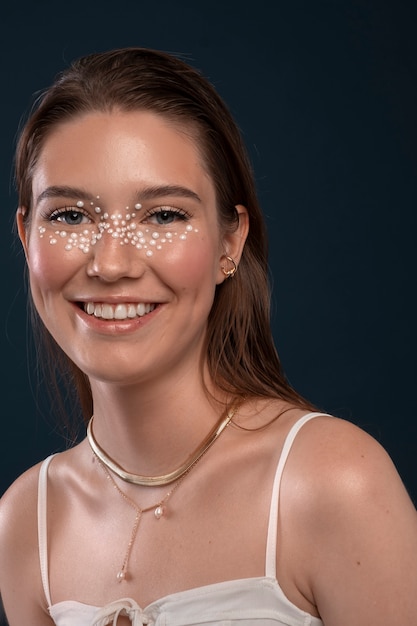 Free photo portrait of woman wearing jewelry makeup