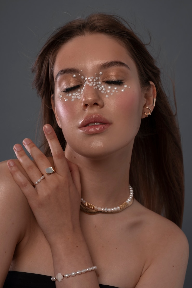 Free Photo portrait of woman wearing jewelry makeup