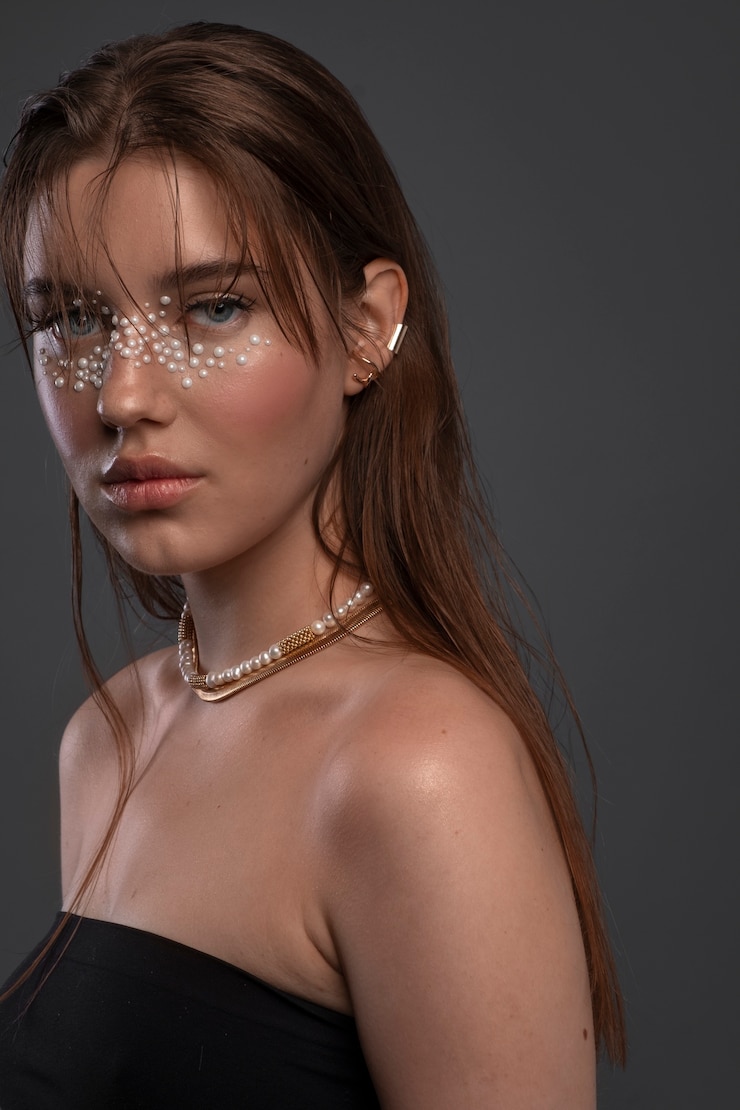 Free Photo portrait of woman wearing jewelry makeup