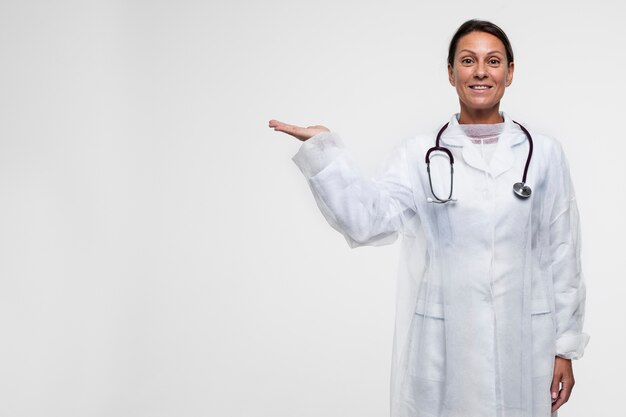 Portrait of woman wearing medical gown with stethoscope