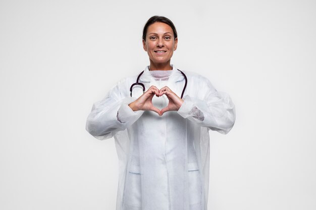 Portrait of woman wearing medical gown with stethoscope