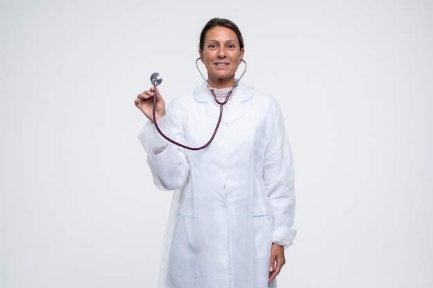 Portrait of woman wearing medical gown with stethoscope