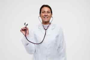 Free photo portrait of woman wearing medical gown with stethoscope