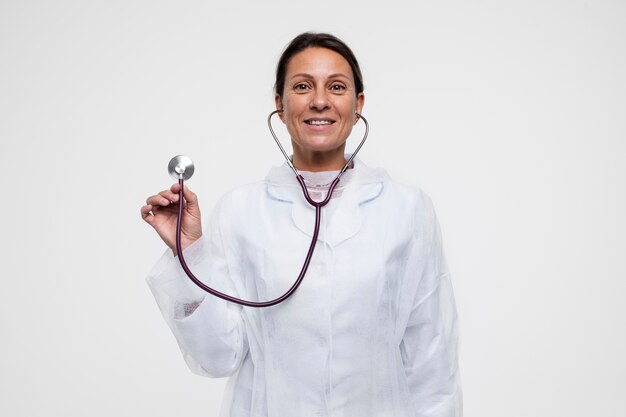 Portrait of woman wearing medical gown with stethoscope