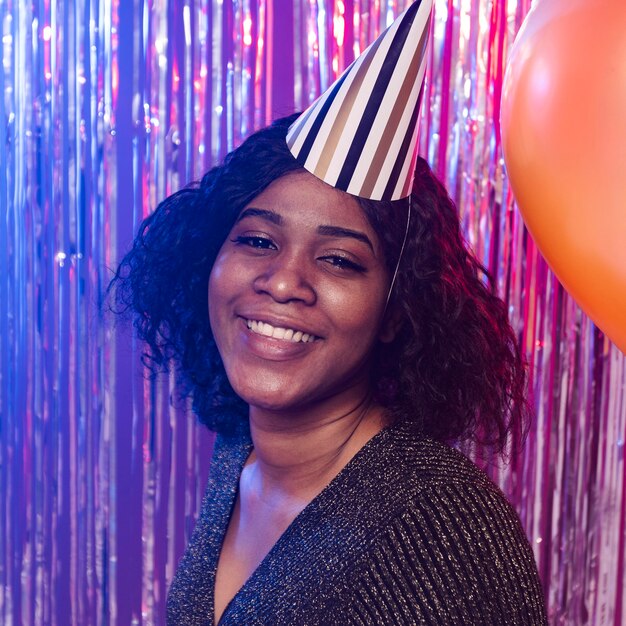 Portrait of woman wearing a party hat