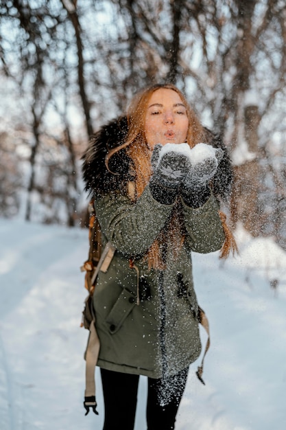 Portrait woman with backpack on winter day