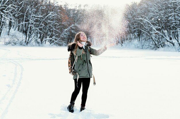 Portrait woman with backpack on winter day