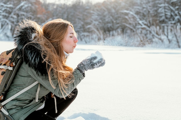 Portrait woman with backpack on winter day