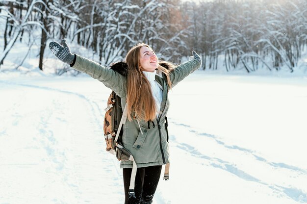 Portrait woman with backpack on winter day